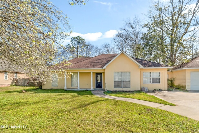 single story home with a front lawn, fence, driveway, and stucco siding