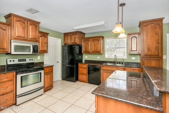 kitchen with visible vents, pendant lighting, light tile patterned floors, black appliances, and a sink