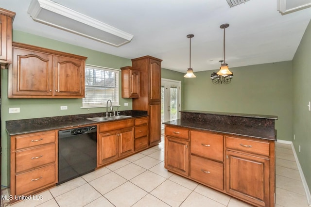 kitchen featuring pendant lighting, a sink, brown cabinetry, light tile patterned floors, and dishwasher