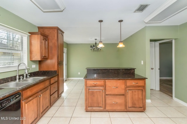 kitchen featuring visible vents, light tile patterned flooring, a sink, hanging light fixtures, and dishwasher