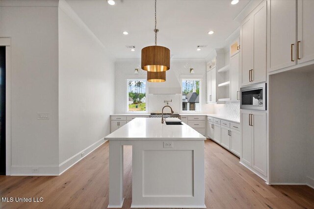 462 Whittington Cir, Madison, MS 39110 - kitchen with open shelves, light countertops, built in microwave, tasteful backsplash, and a sink