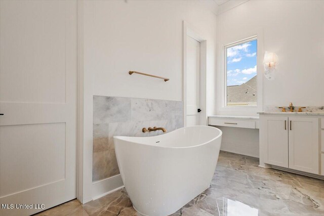 462 Whittington Cir, Madison, MS 39110 - full bathroom with vanity, marble finish floor, a freestanding bath, and wainscoting