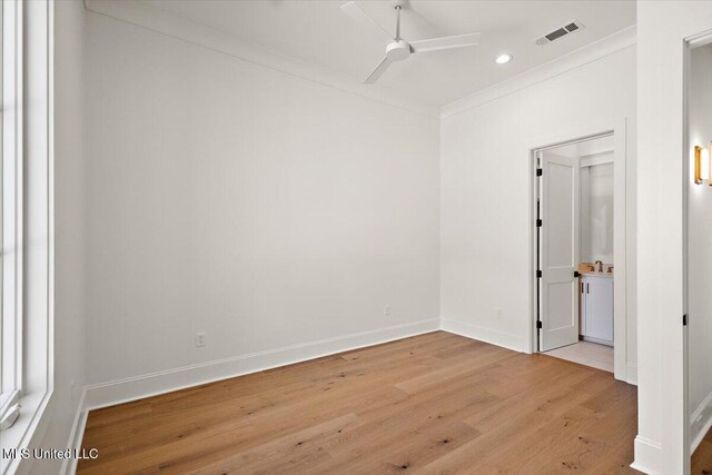 462 Whittington Cir, Madison, MS 39110 - spare room featuring a ceiling fan, visible vents, baseboards, ornamental molding, and light wood-style flooring