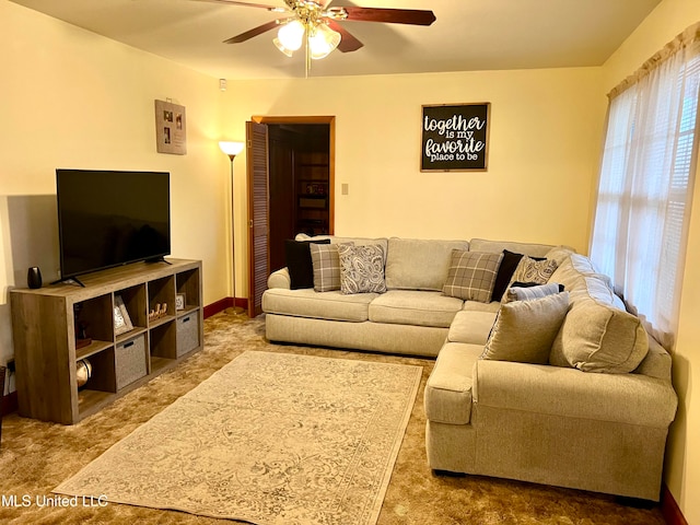 living room with carpet flooring and ceiling fan