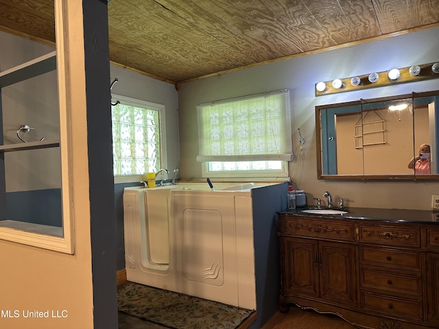 washroom featuring an ornate ceiling and a sink