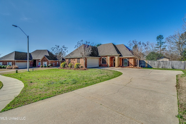 view of front facade featuring a garage and a front yard