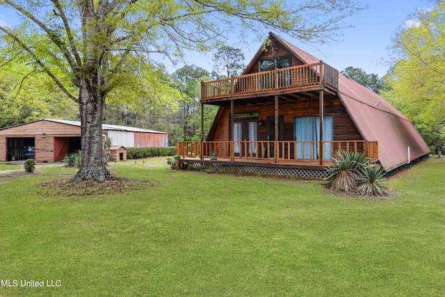 rear view of house featuring a wooden deck, french doors, and a yard