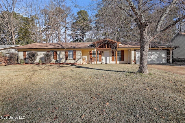 single story home featuring a garage and a front lawn