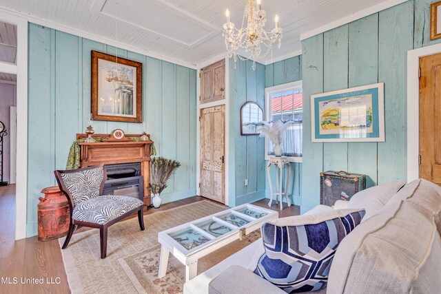 253 Sycamore St, Bay Saint Louis, MS 39520 - living area with an inviting chandelier and wood finished floors