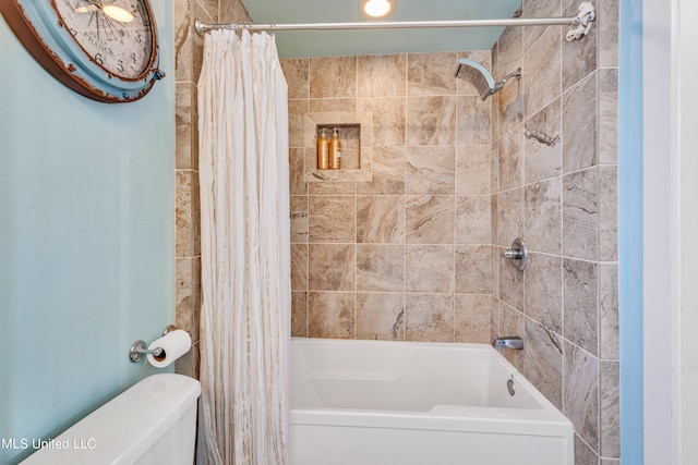 bathroom featuring toilet and shower / bath combo