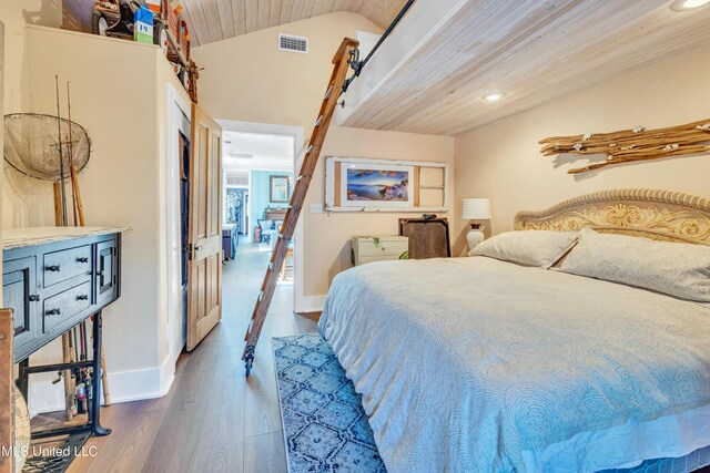 253 Sycamore St, Bay Saint Louis, MS 39520 - bedroom with baseboards, recessed lighting, wood finished floors, and visible vents
