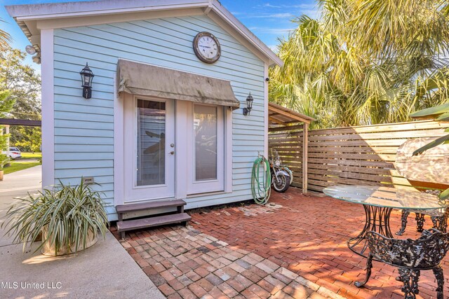 253 Sycamore St, Bay Saint Louis, MS 39520 - view of outbuilding with fence and entry steps