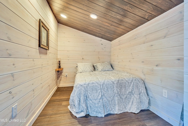 unfurnished bedroom with wood ceiling, wood walls, vaulted ceiling, and dark hardwood / wood-style floors