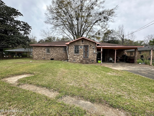 view of front facade featuring driveway, a front yard, an attached carport, brick siding, and crawl space