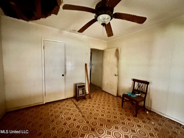 unfurnished bedroom featuring ceiling fan and tile patterned floors