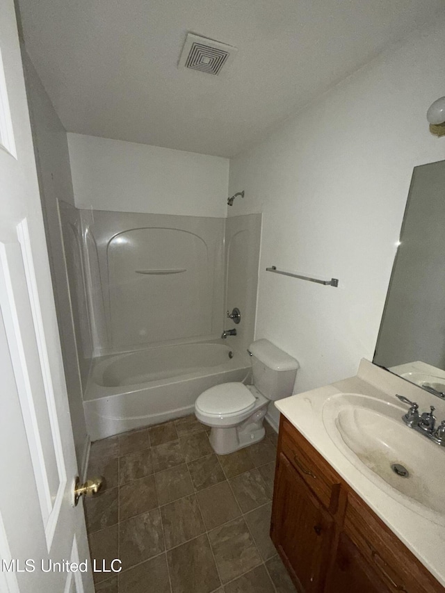 full bathroom with washtub / shower combination, vanity, and toilet