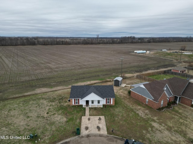 birds eye view of property featuring a rural view