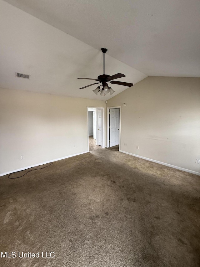 carpeted empty room with vaulted ceiling and ceiling fan