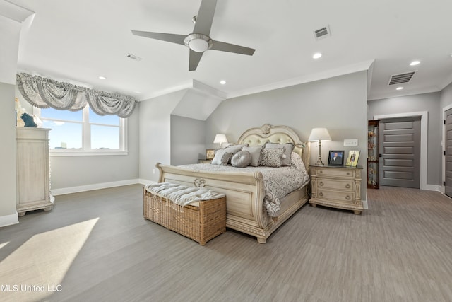 bedroom with ornamental molding, hardwood / wood-style floors, and ceiling fan