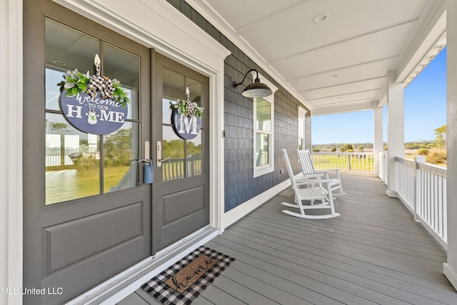 wooden terrace featuring a porch