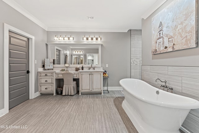 bathroom featuring a tub, hardwood / wood-style floors, tile walls, vanity, and crown molding