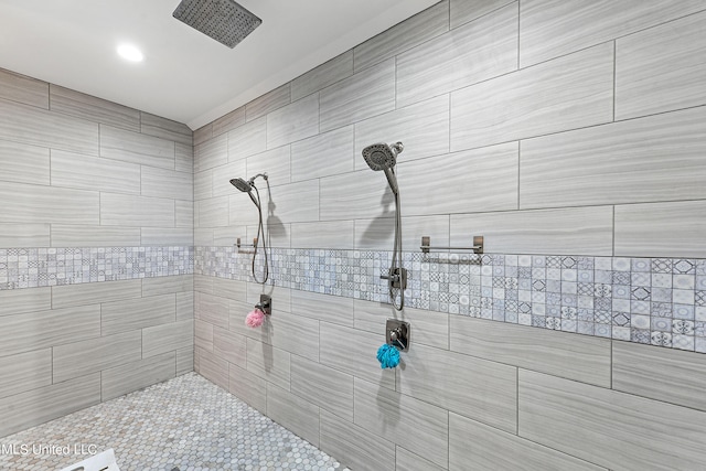 bathroom with tiled shower