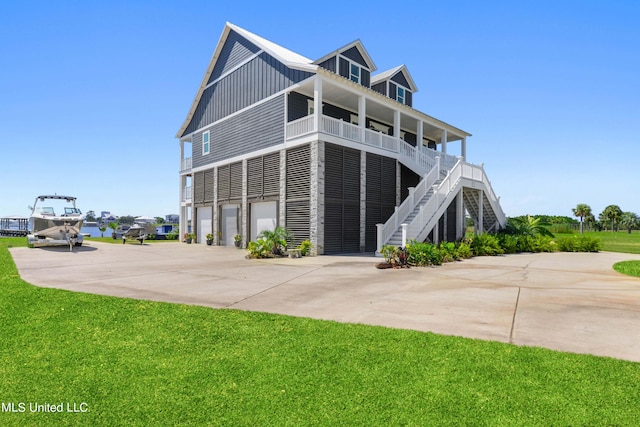 exterior space featuring a garage and a lawn