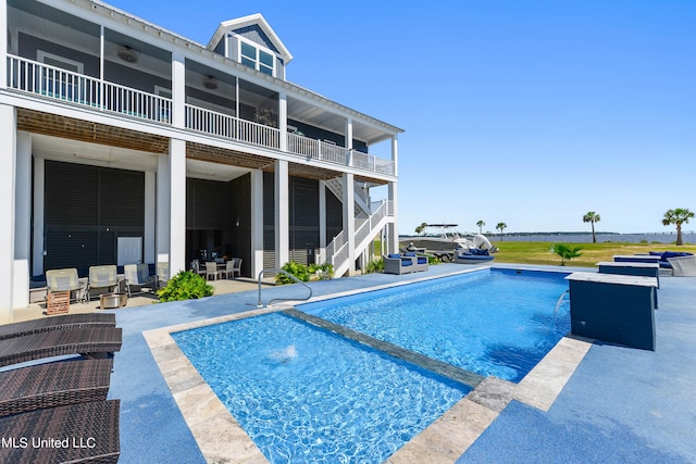 view of swimming pool featuring a patio area and pool water feature