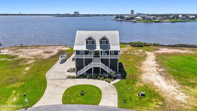 birds eye view of property featuring a water view