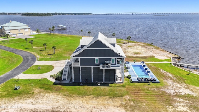 birds eye view of property featuring a water view