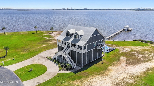 birds eye view of property with a water view