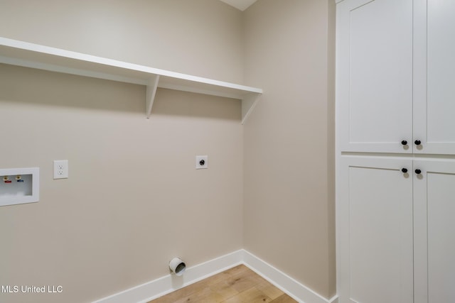 4054 Mallard St, Bay Saint Louis, MS 39520 - laundry room with electric dryer hookup, light wood-style floors, hookup for a washing machine, and baseboards