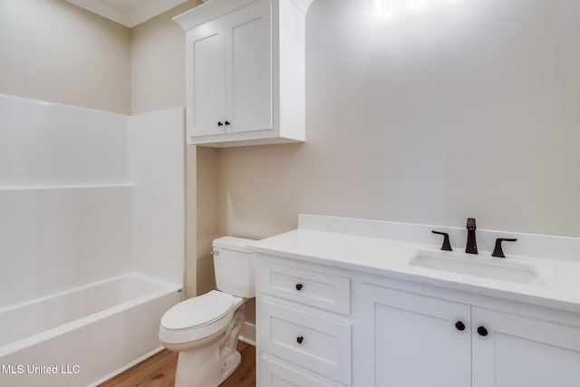 4054 Mallard St, Bay Saint Louis, MS 39520 - full bathroom featuring toilet, wood finished floors, vanity, and shower / washtub combination