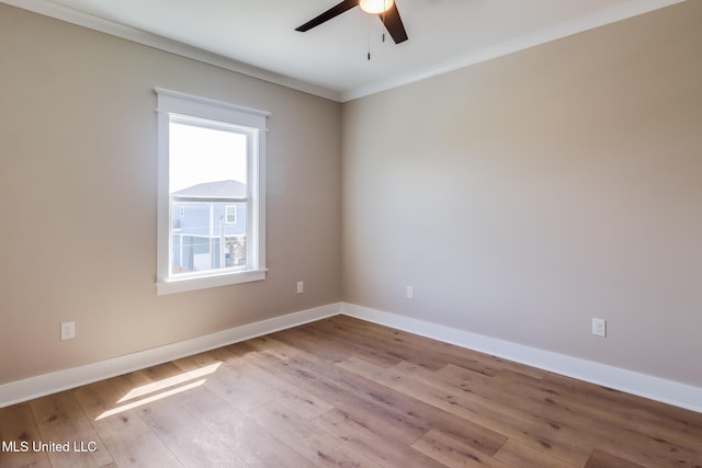 4054 Mallard St, Bay Saint Louis, MS 39520 - empty room featuring a ceiling fan, wood-type flooring, baseboards, and crown molding