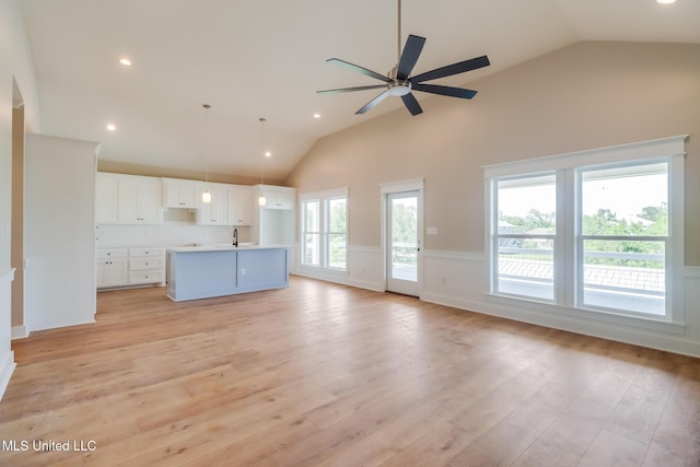 4054 Mallard St, Bay Saint Louis, MS 39520 - unfurnished living room featuring a wainscoted wall, a ceiling fan, light wood-style flooring, recessed lighting, and a sink