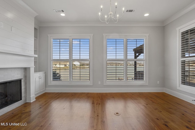 unfurnished dining area featuring ornamental molding, plenty of natural light, and visible vents