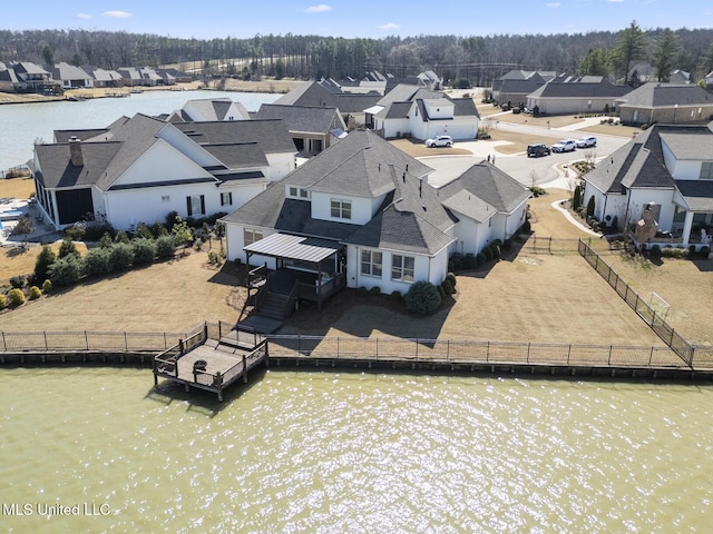 aerial view featuring a water view and a residential view