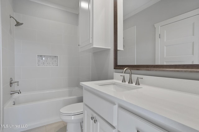 full bath with tile patterned flooring, bathtub / shower combination, vanity, and toilet