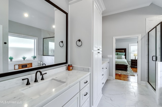 bathroom with vaulted ceiling, an enclosed shower, crown molding, and vanity