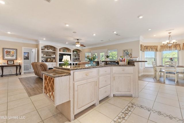 12441 Old Cypress Creek Cv, Diberville, MS 39540 - kitchen with light tile patterned flooring, a chandelier, recessed lighting, a ceiling fan, and ornamental molding