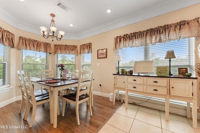 12441 Old Cypress Creek Cv, Diberville, MS 39540 - dining area with ornamental molding, a chandelier, recessed lighting, and light wood finished floors