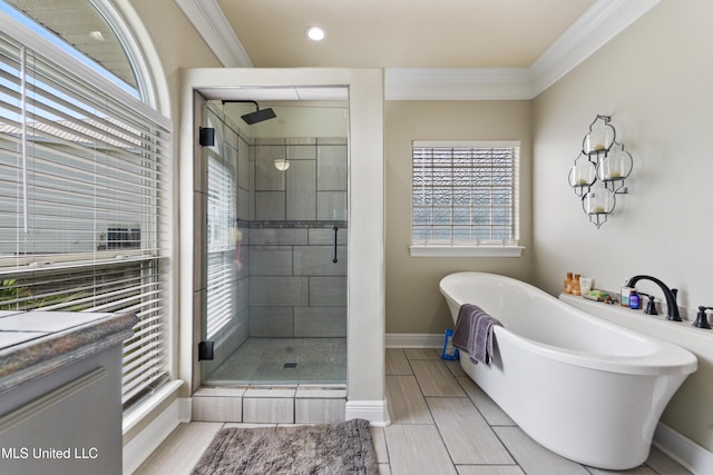 12441 Old Cypress Creek Cv, Diberville, MS 39540 - full bathroom with a shower stall, a freestanding tub, crown molding, and recessed lighting