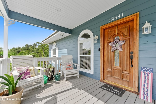 12441 Old Cypress Creek Cv, Diberville, MS 39540 - doorway to property featuring a porch