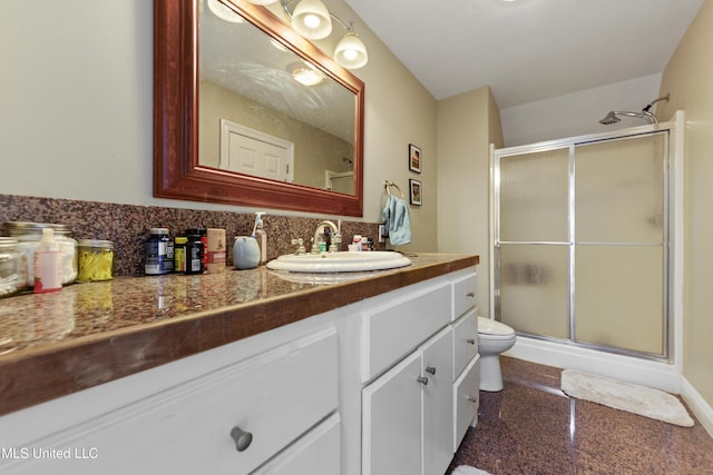 12441 Old Cypress Creek Cv, Diberville, MS 39540 - bathroom featuring vanity, a shower stall, decorative backsplash, and granite floors