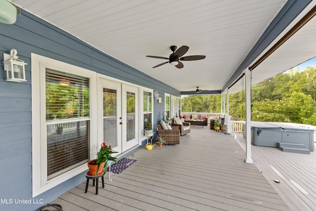 12441 Old Cypress Creek Cv, Diberville, MS 39540 - deck with french doors, a hot tub, an outdoor hangout area, and ceiling fan