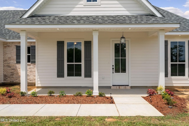 doorway to property with covered porch