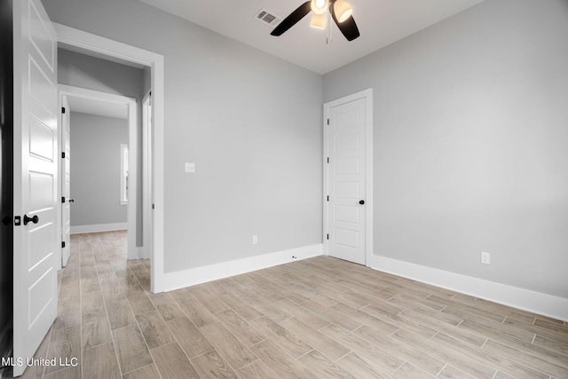 unfurnished room featuring light hardwood / wood-style floors and ceiling fan