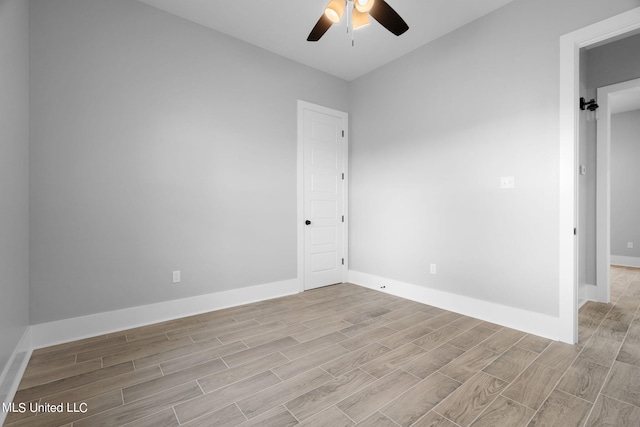 spare room with light hardwood / wood-style flooring and ceiling fan