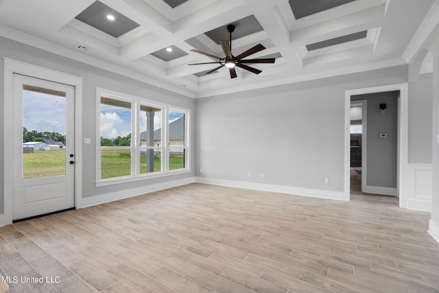 unfurnished room with ceiling fan, coffered ceiling, beamed ceiling, and light wood-type flooring