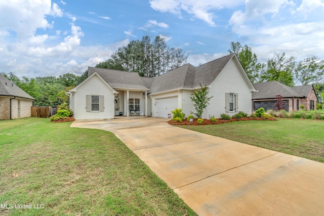 view of front of property featuring a garage and a front yard